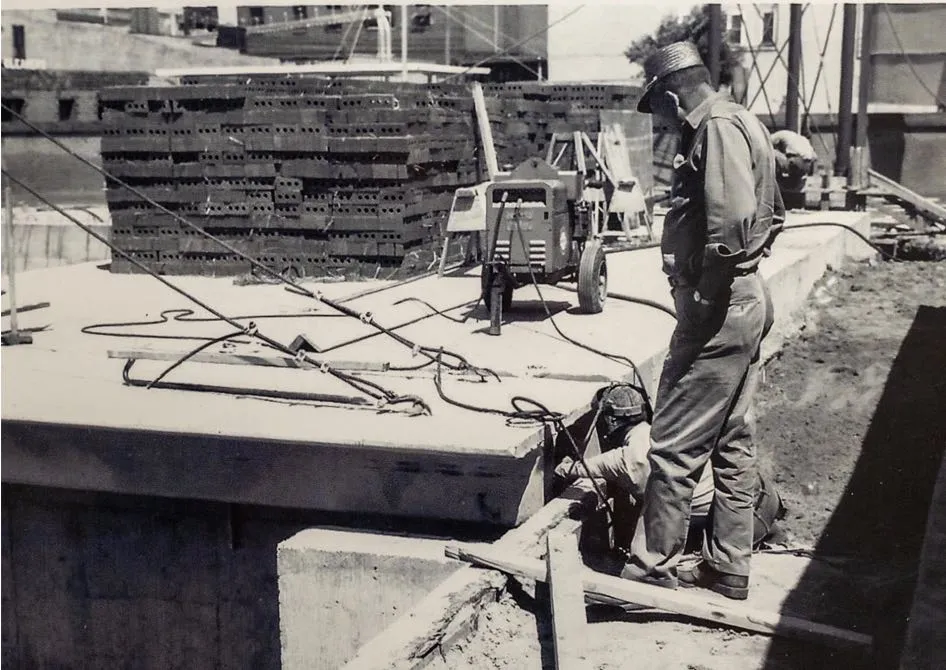 Historical photo of Dahme worker on job site