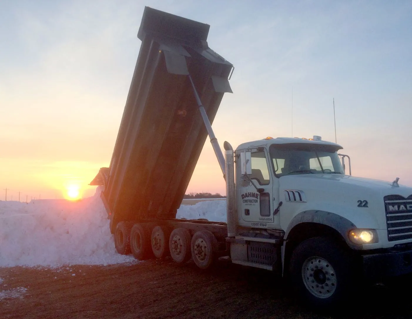 Truck dumping snow