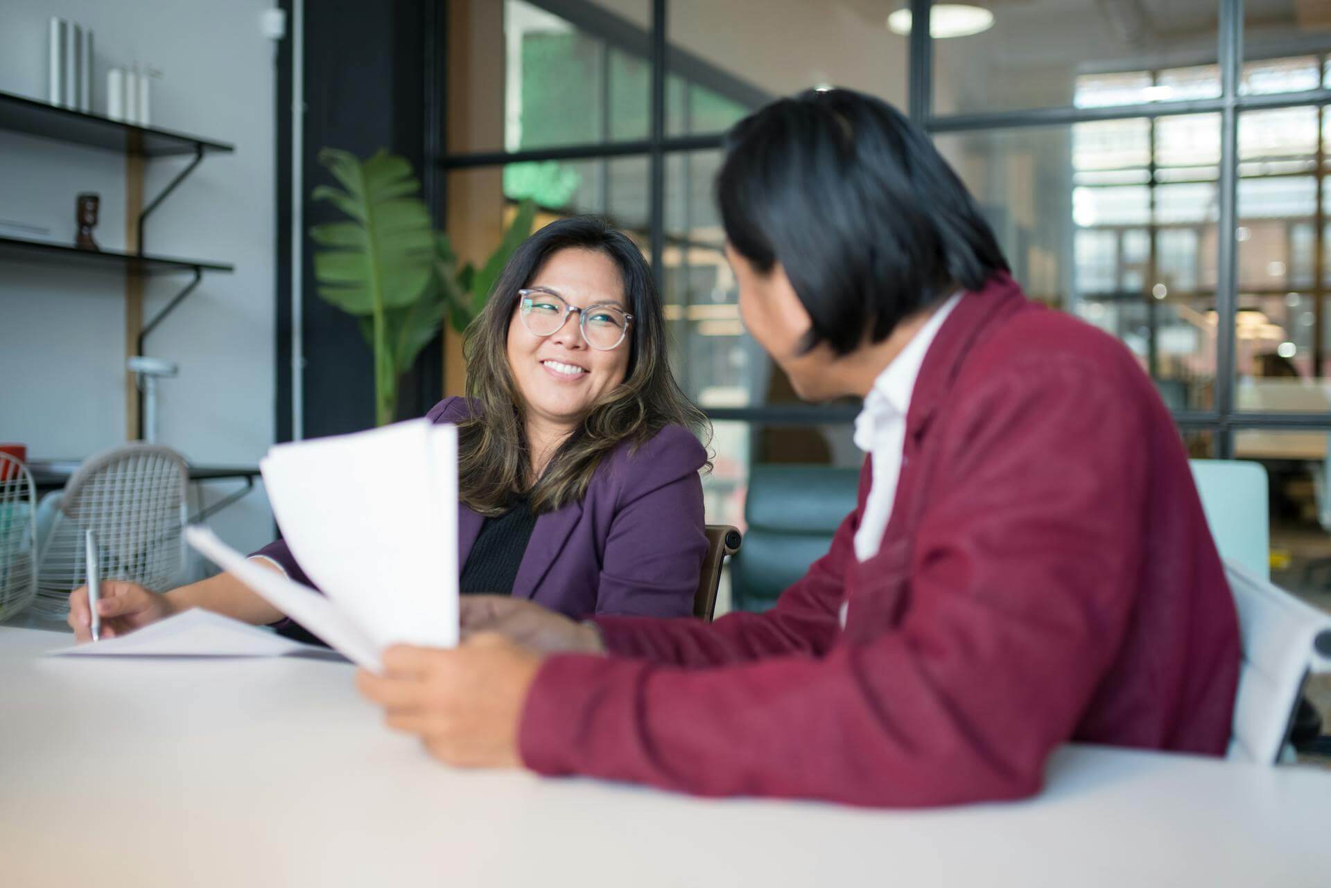 Employees discussing a change initiative around a table