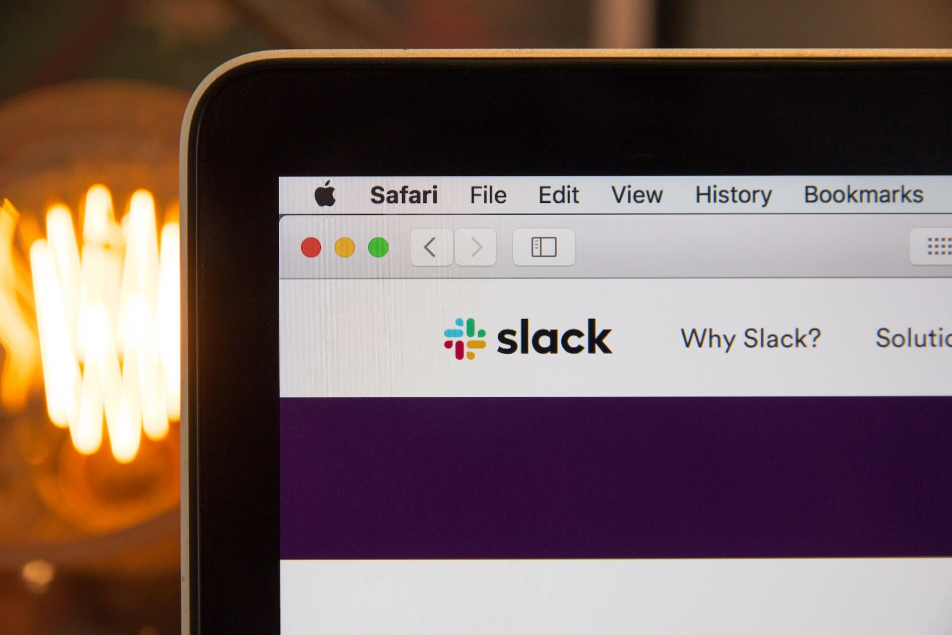 Slack website displayed on a laptop screen
