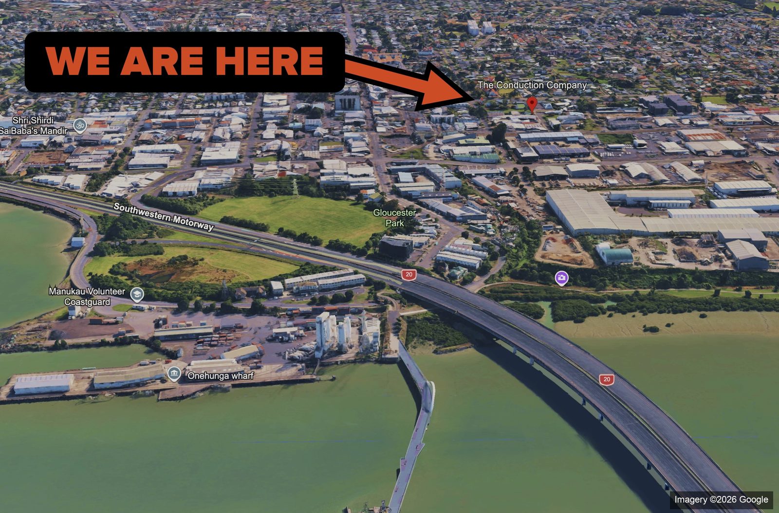Aerial view of Onehunga wharf and the Manukau Harbour, with a WE ARE HERE marker on the office location.