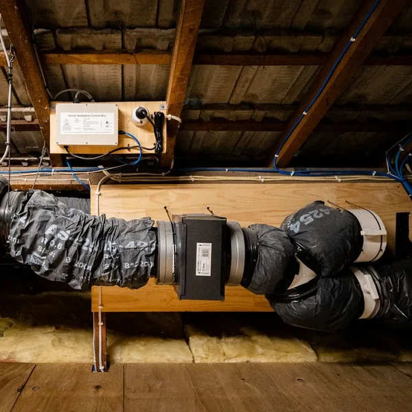 A home ventilation system in a roof space, with insulated ducting, a filter box and a control unit