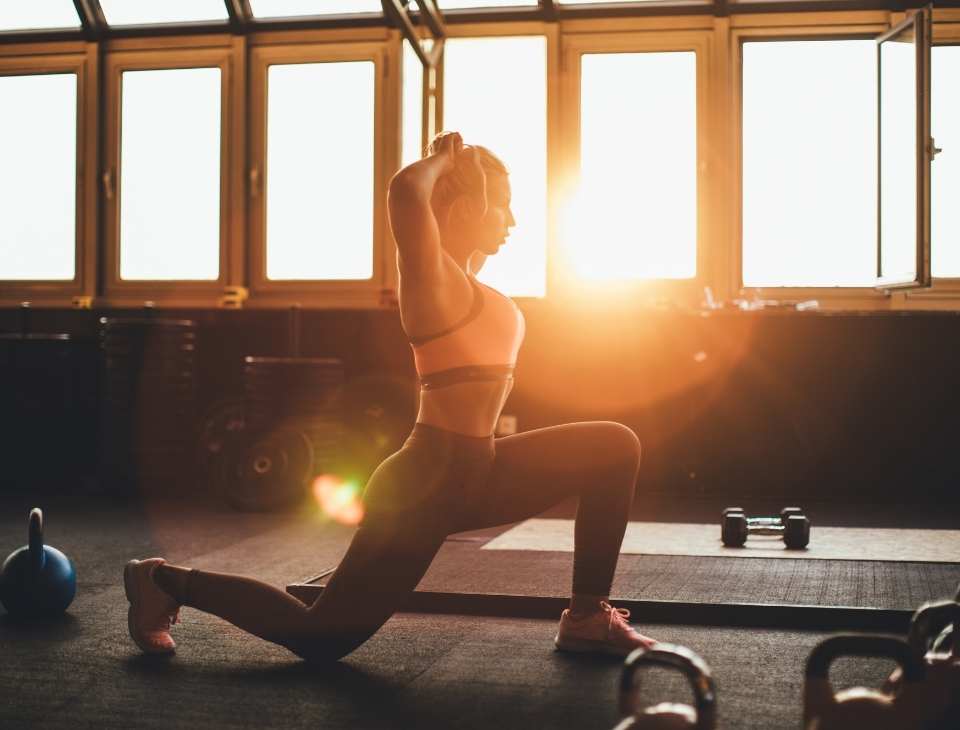 A woman in a fitness class in a Holmes Place Club.