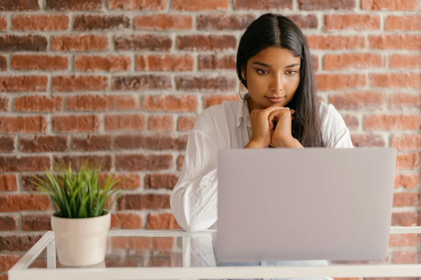 Woman sitting in front of laptop