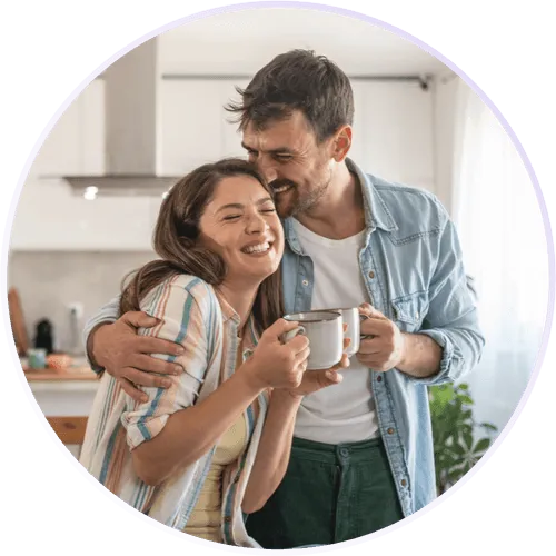 a man and a woman smiling and embracing