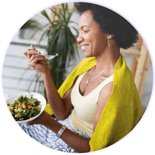 a woman eating a salad