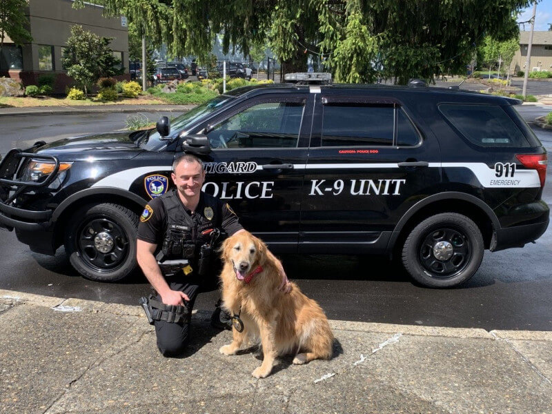 K9 Jerry with Officer in front of Police Car