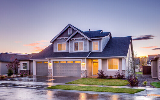 Blue and Gray Concrete House With Attic during Twilight