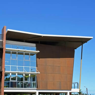 brown concrete building under blue sky during daytime
