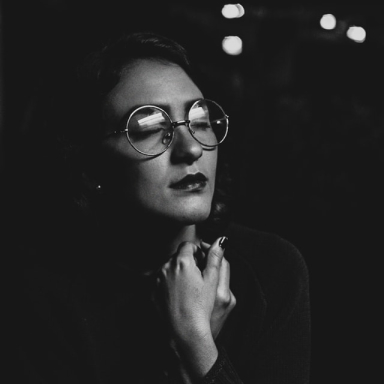 grayscale photo of woman wearing eyeglasses