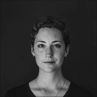 grayscale photo of woman wearing necklace and top