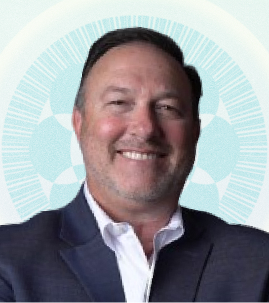 Headshot of Managing Director John Scambray against tan background