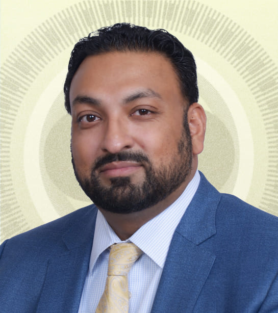 Headshot of Kevin Jamali against green ripple background