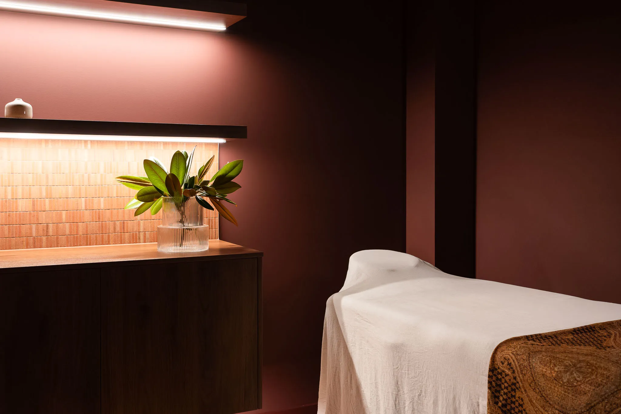 dim lit, relaxing massage and acupuncture room 