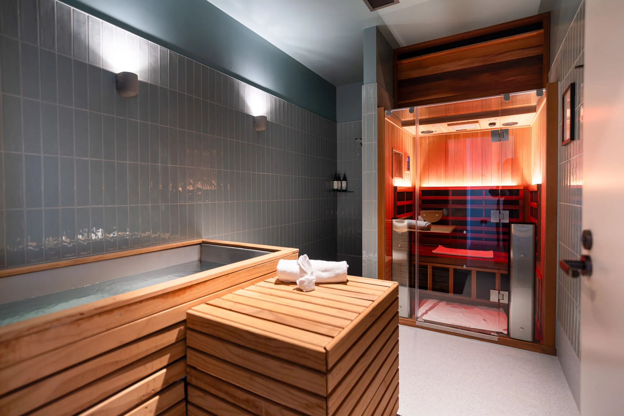 Women sitting in O-Studio Remuera Communal Sauna