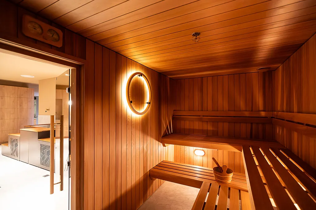 Women sitting in O-Studio Remuera Communal Sauna