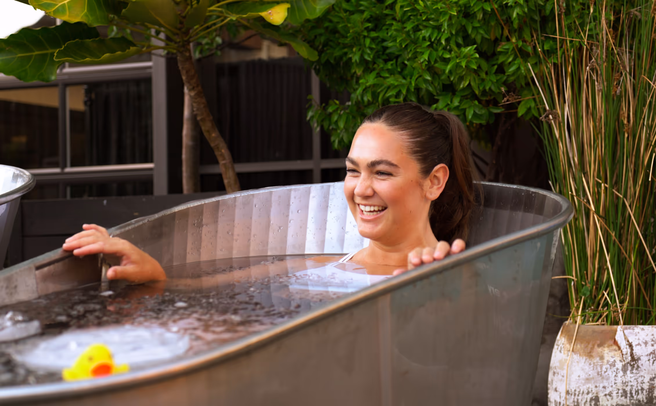 Women sitting in O-Studio Remuera Communal Sauna