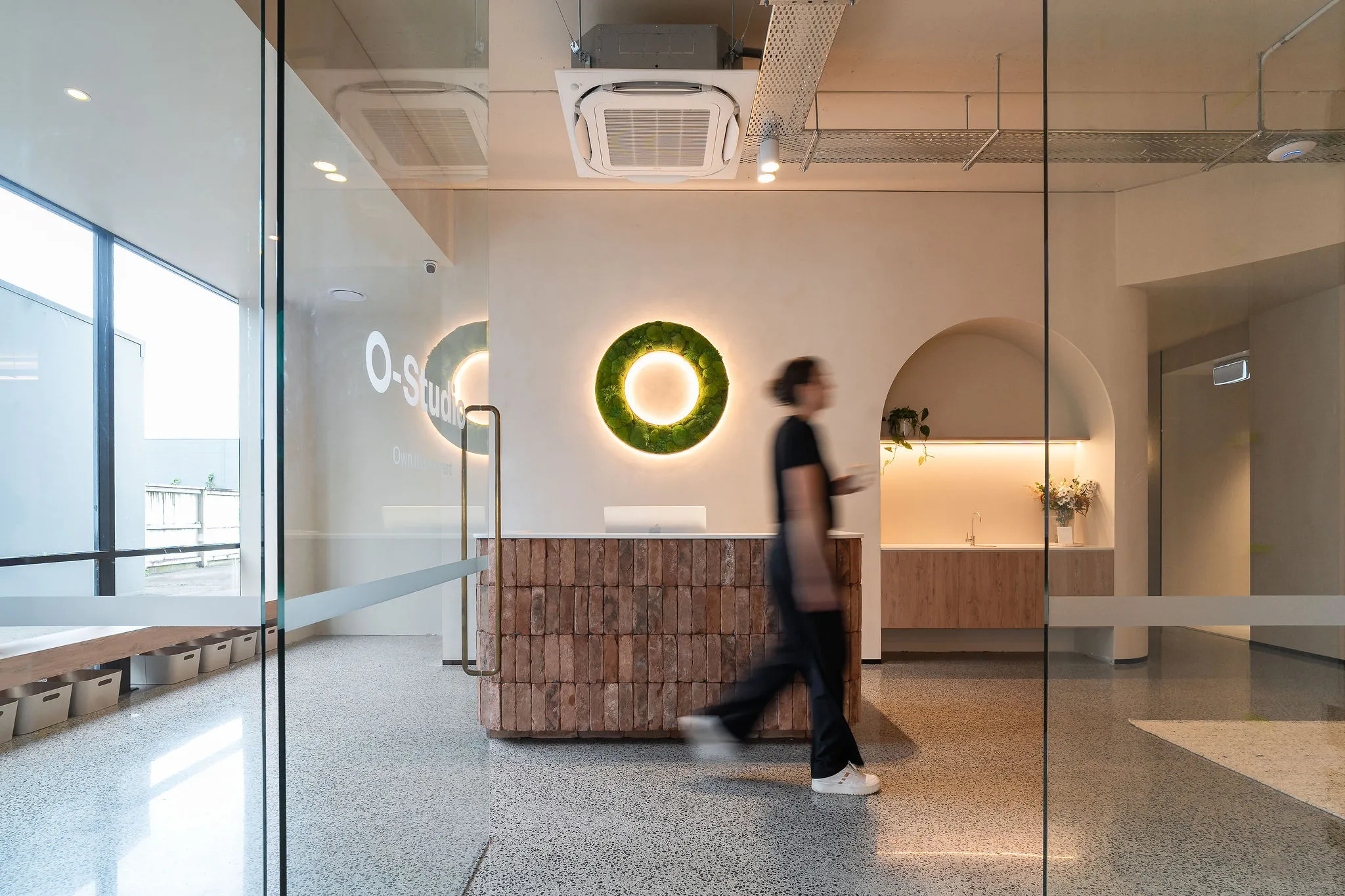 room covered in stone titles with a shower and sauna