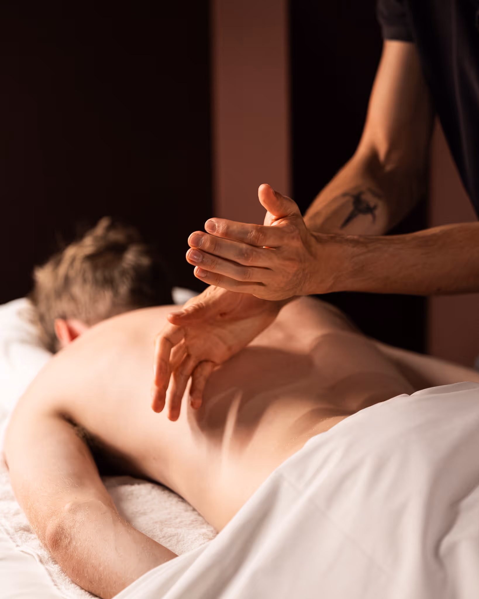 A lady relaxing while getting a facial acupuncture in Remuera