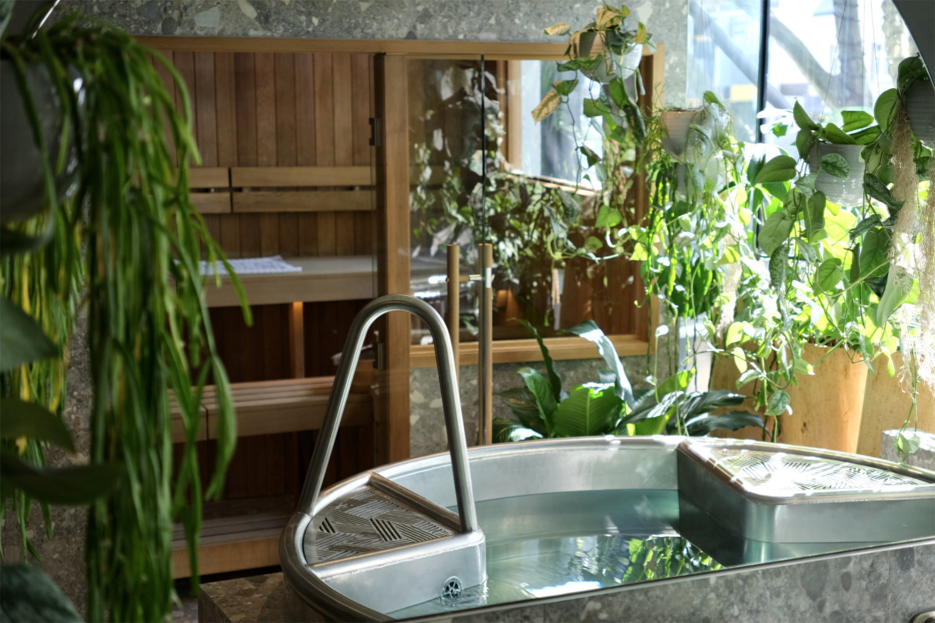 Women sitting in O-Studio Remuera Communal Sauna