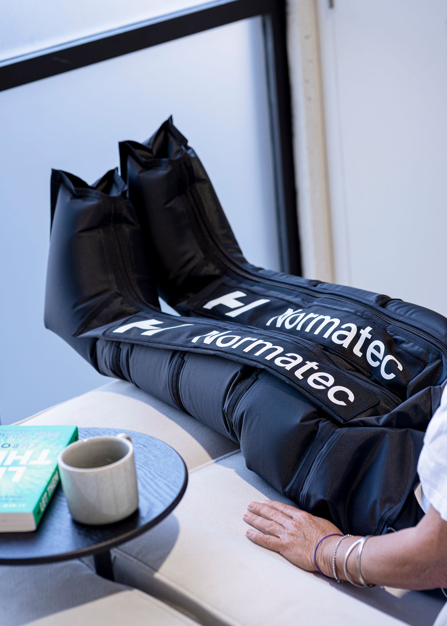 Women sitting in O-Studio Remuera Communal Sauna