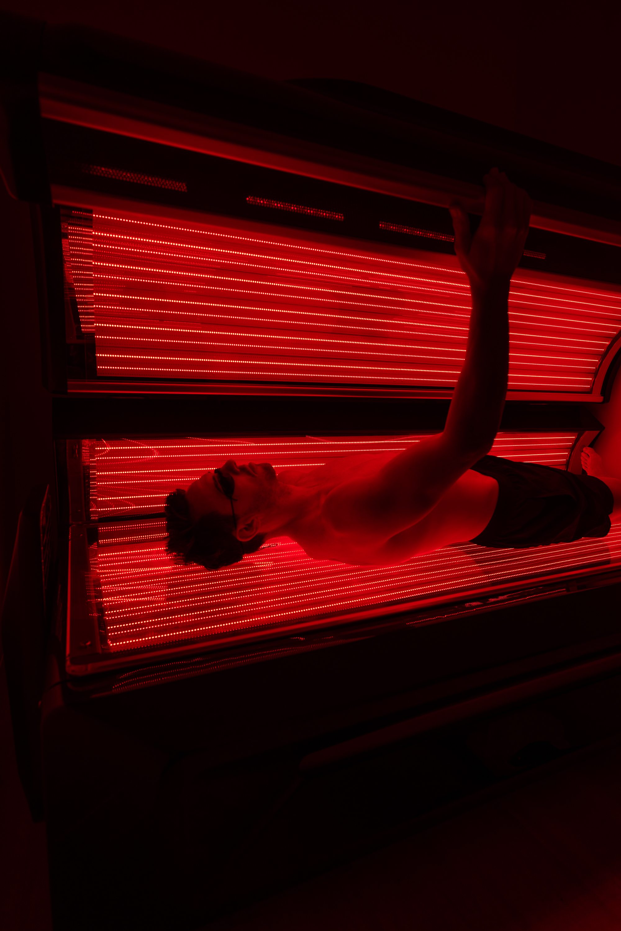 Four people sitting and talking in a communal sauna in Remuera
