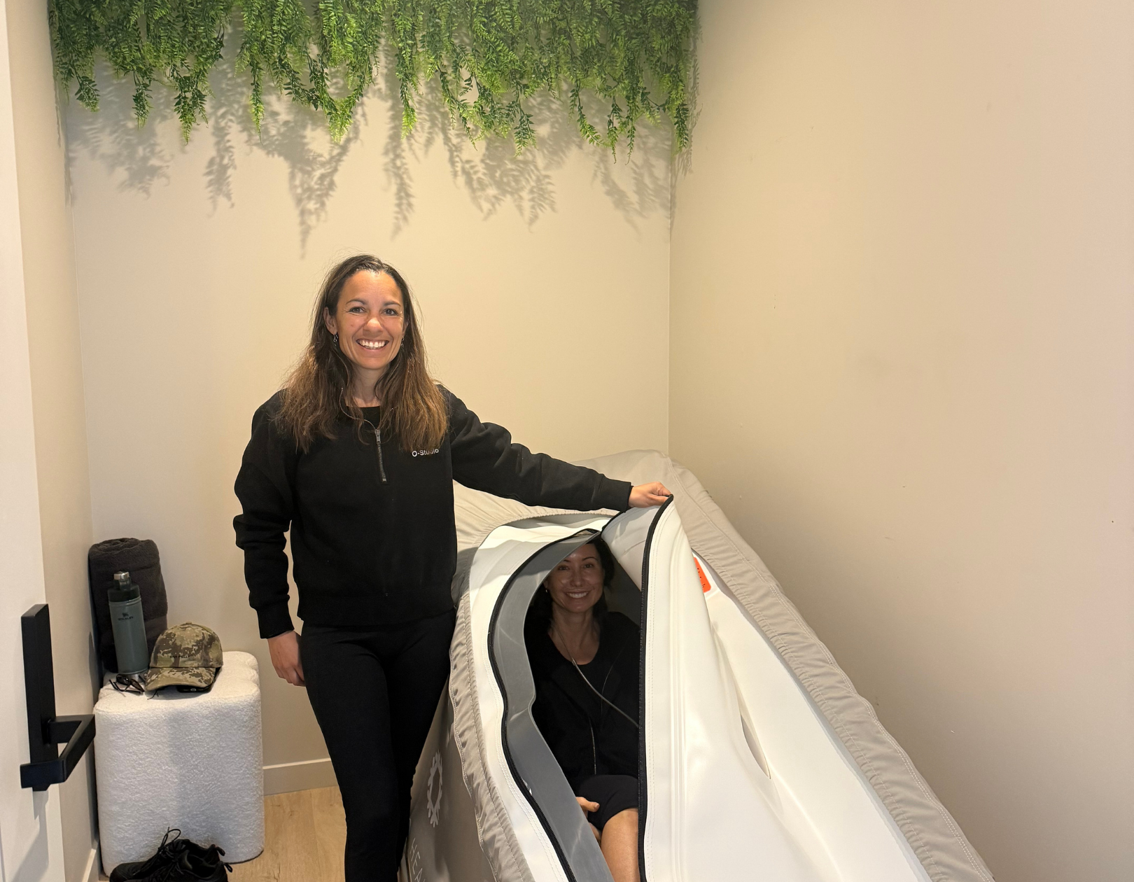 Women sitting in O-Studio Remuera Communal Sauna