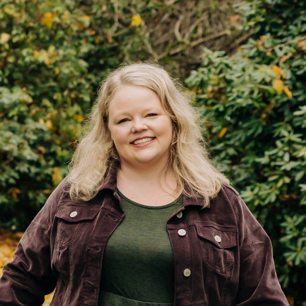 Megan MacDonald, musical theatre faculty at Productions Dance, smiling outdoors.