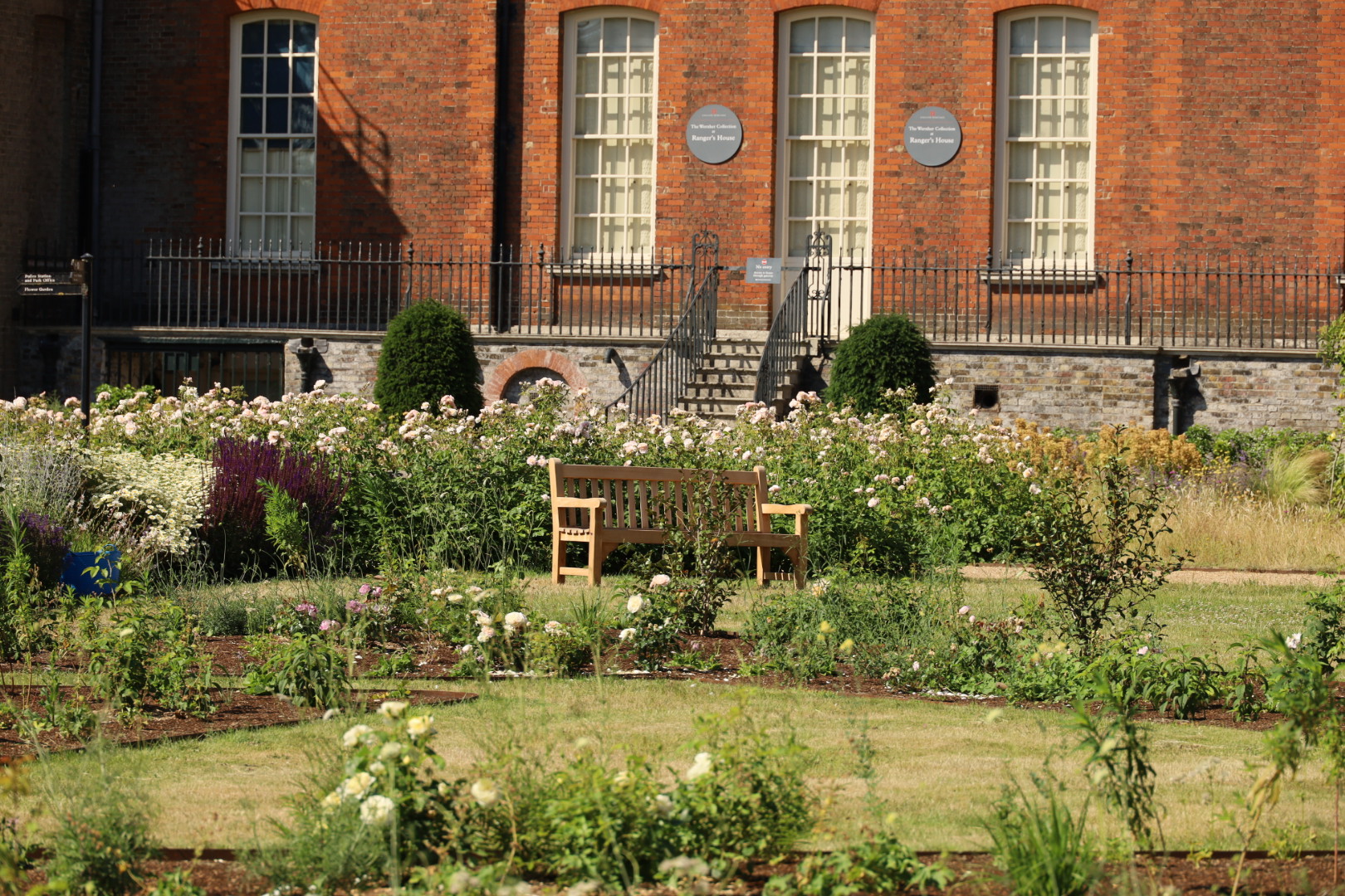Greenwich Park - Rose Garden, Ranger House and roses in the garden on a sunny day