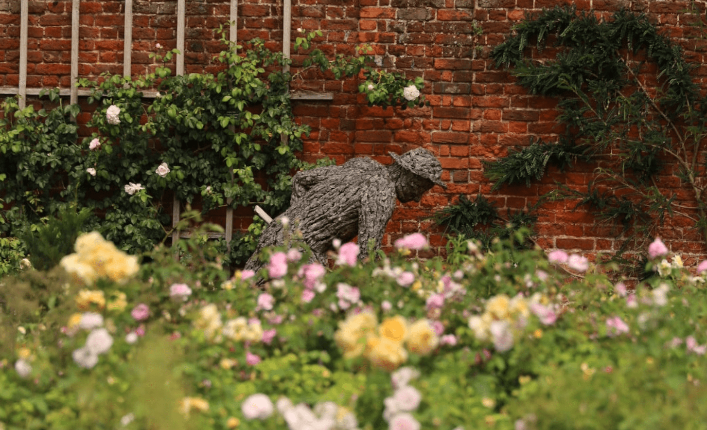 Bark statue of the gardener by Tessa Hayward inside Rose Garden at the Hampton Court Palace, London Rose Gardens