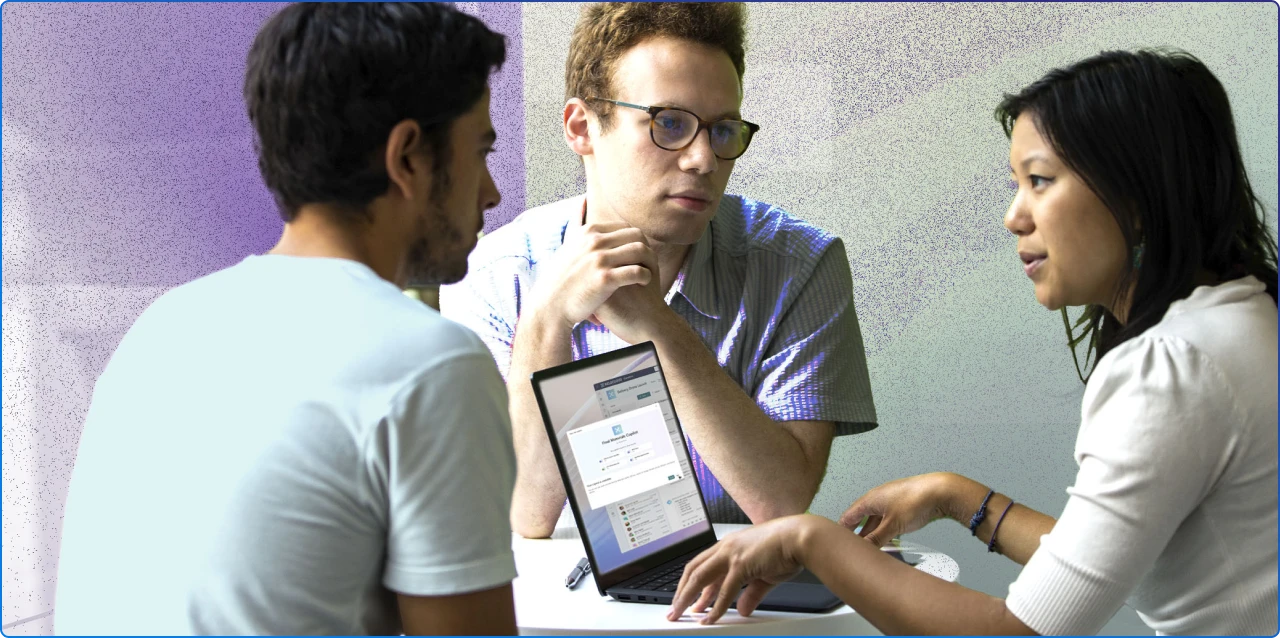 A group of 3 people working together