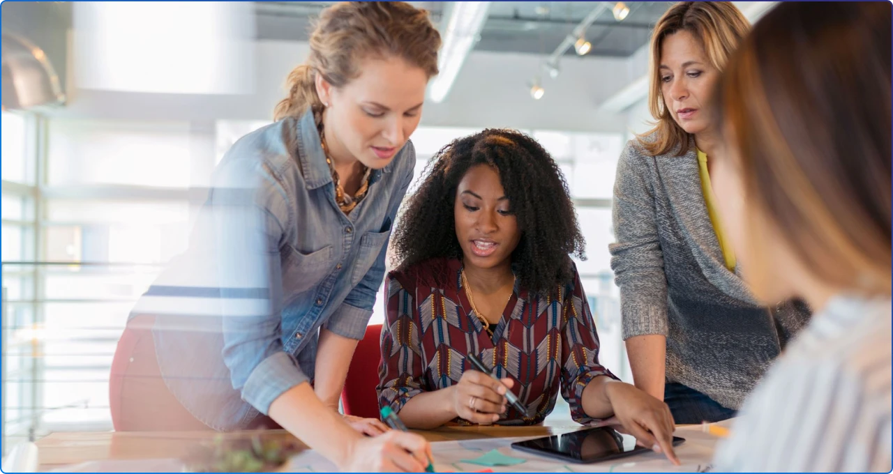 A group of team members working at their desk