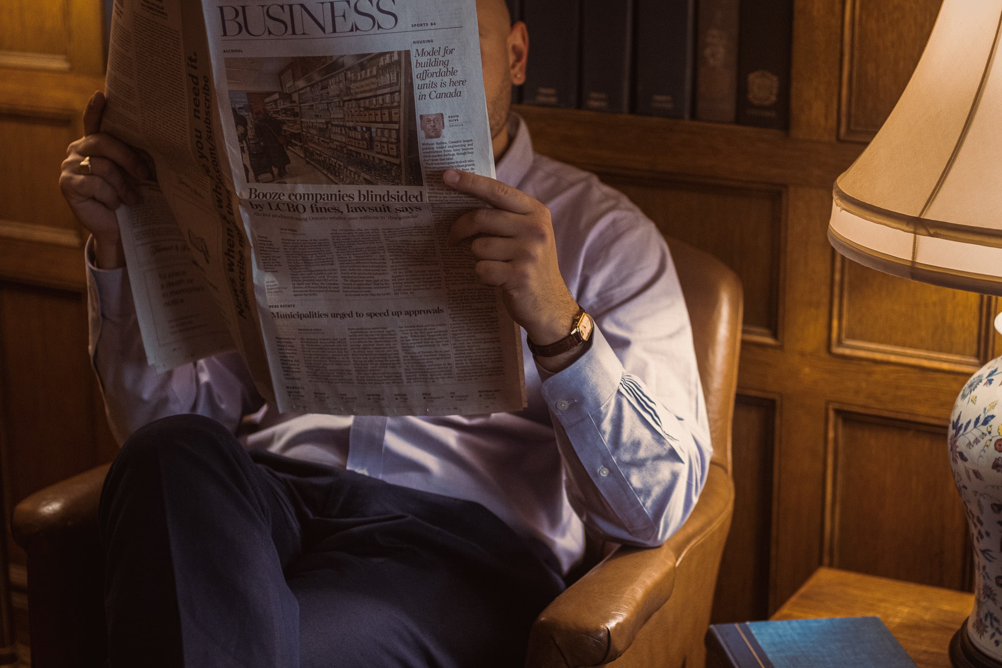 Dusan Baic posing with a cup of coffee in his right and wearing vintage watch on his right