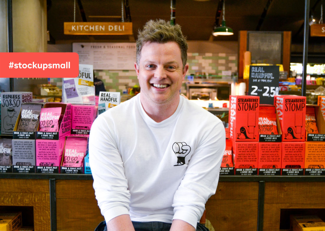 man with a white shirt smiling