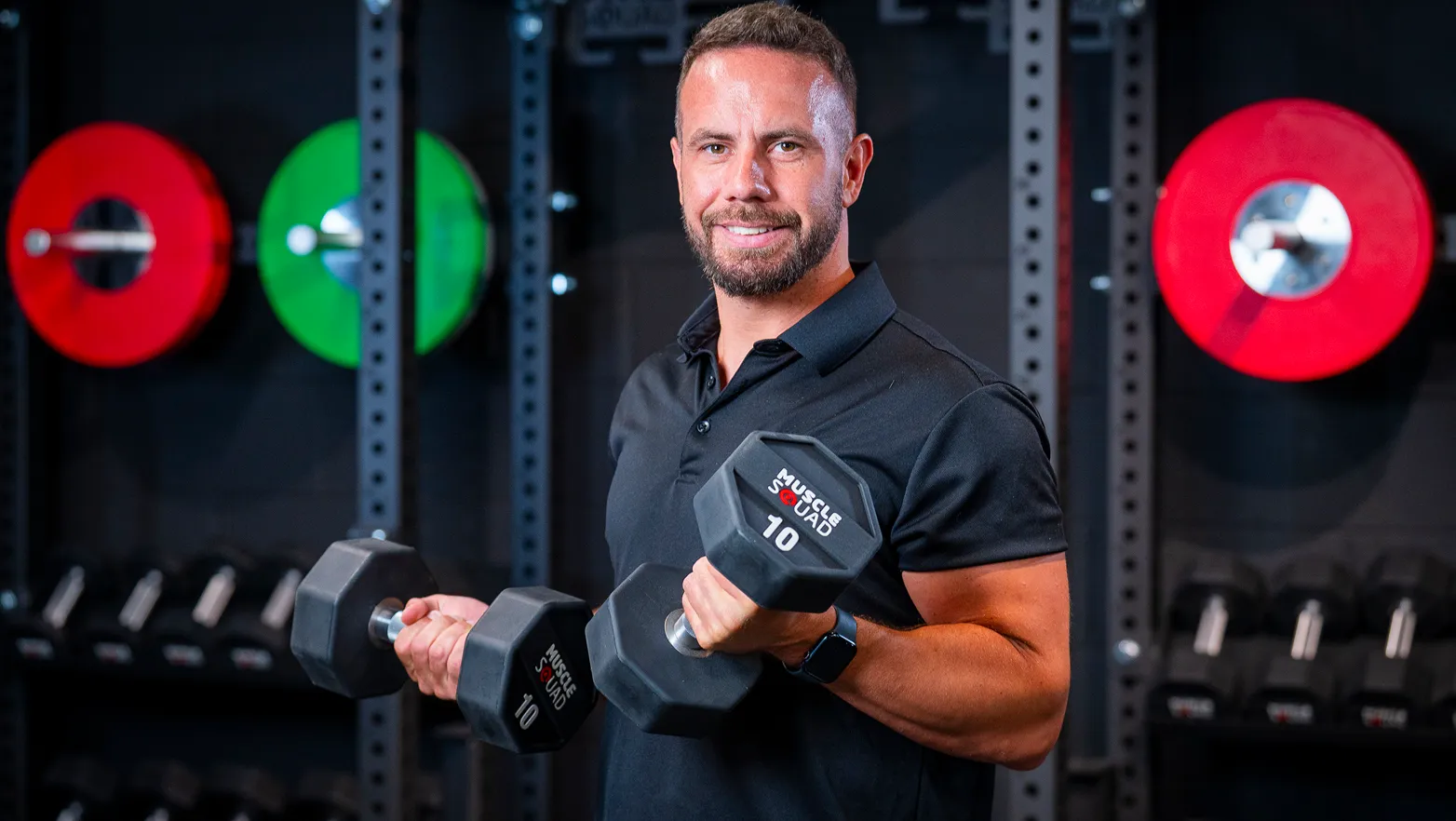 photo of man handling weights