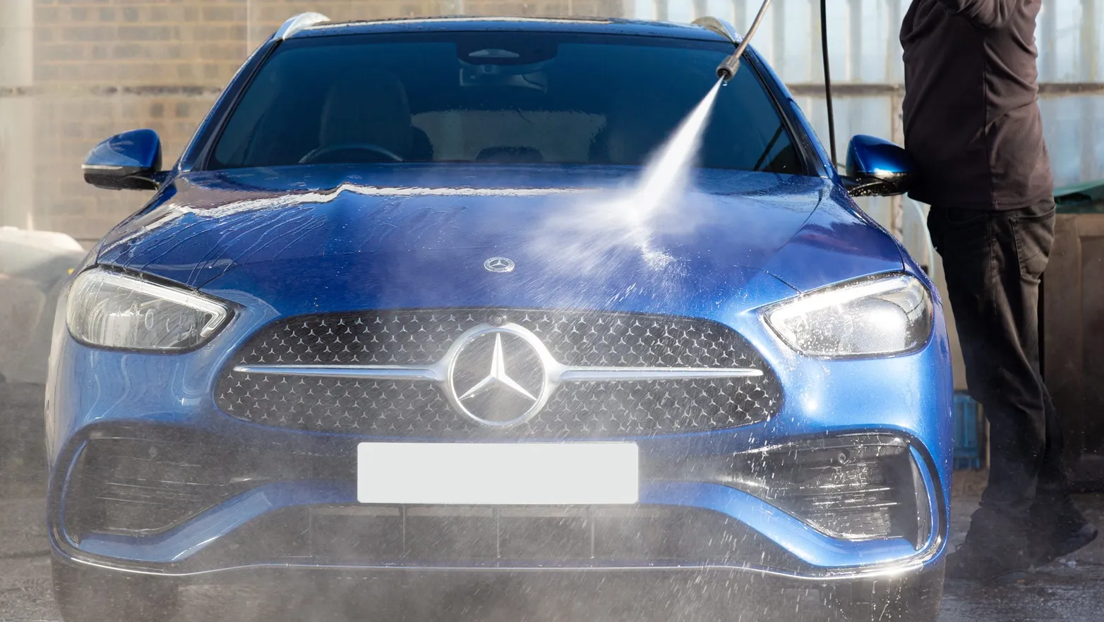 image of a blue mercedes being washed