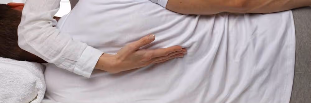 chiropractor adjusting back