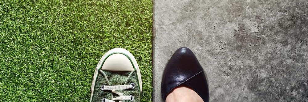 two different feet with different shoes