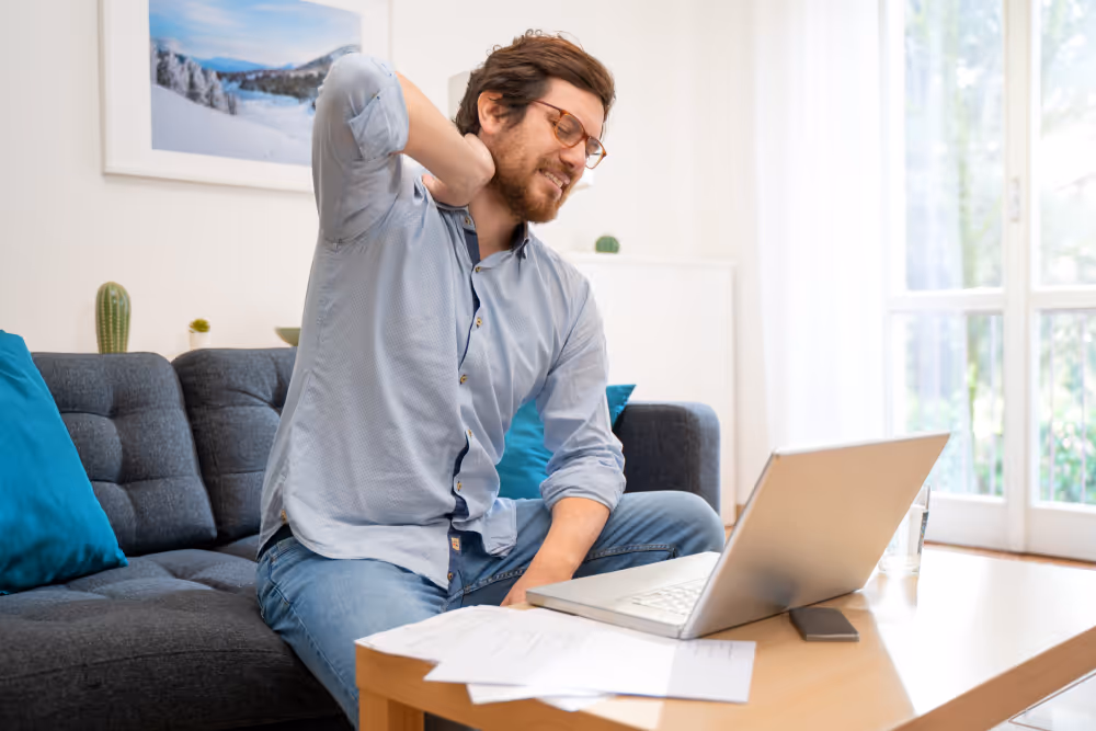 someone grabbing onto aching neck