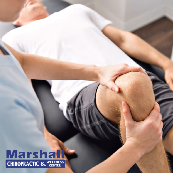 chiropractor adjusting knee