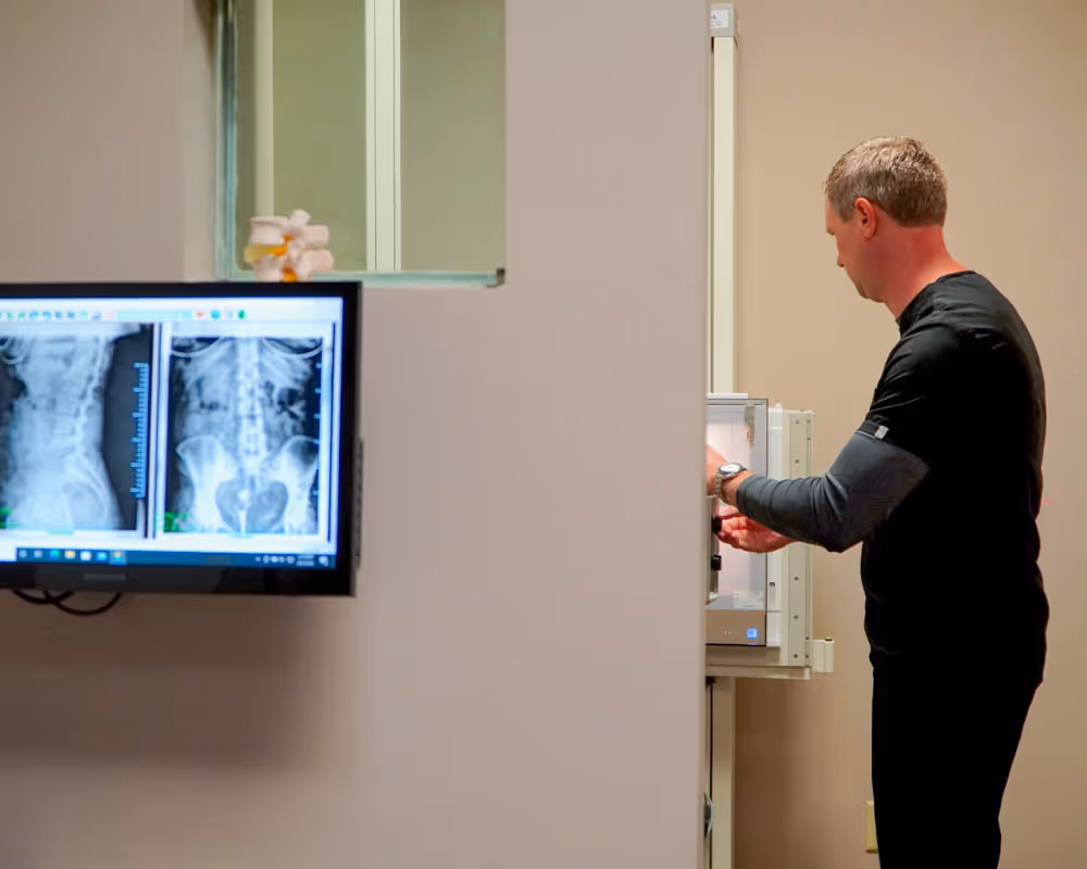 chiropractor showing x-ray