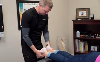 chiropractor adjusting legs