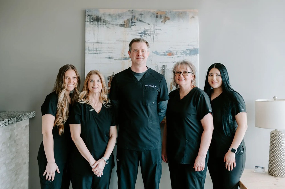 Marshall Chiropractic team standing together in the South Tulsa office