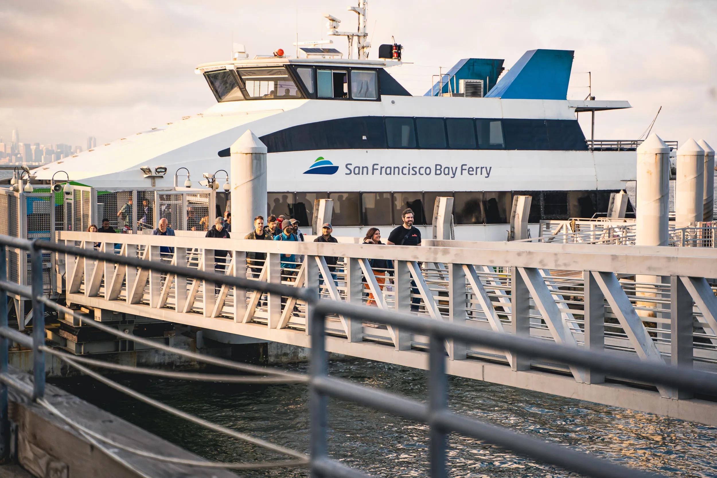 Micromobility America 2022 exhibitors and attendees arrive on the ferry from San Francisco