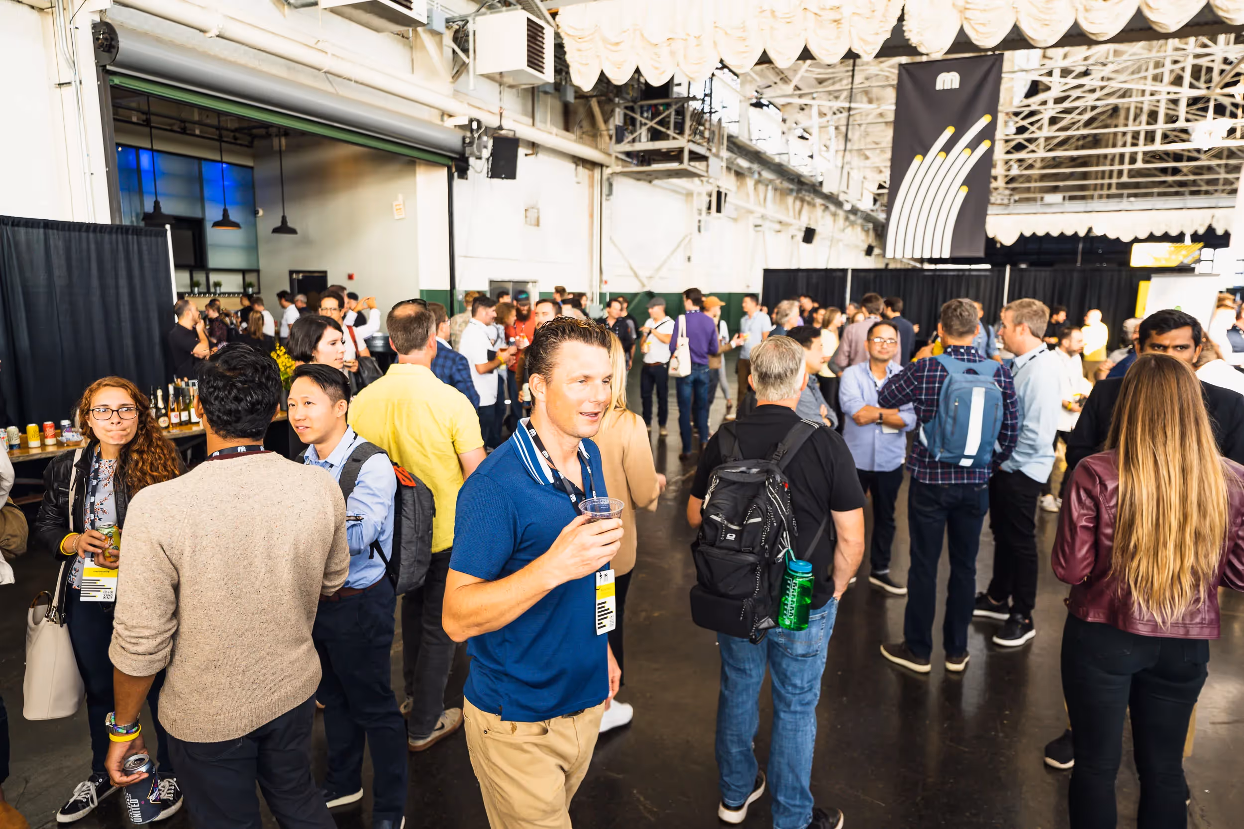 Attendees, speakers and exhibitors enjoy the after party at Micromobility America