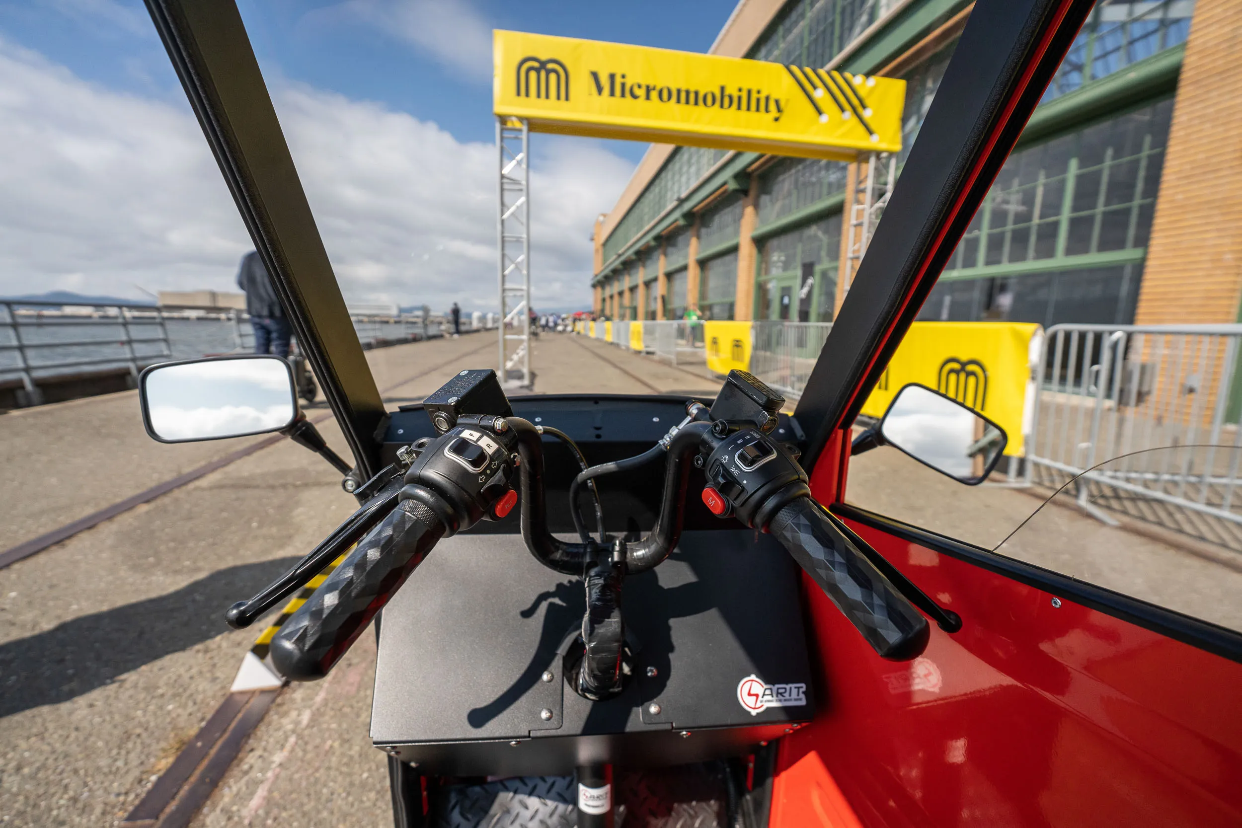 A view of the Micromobility America 2022 Test Track from the rider's perspective inside a Sarit vehicle