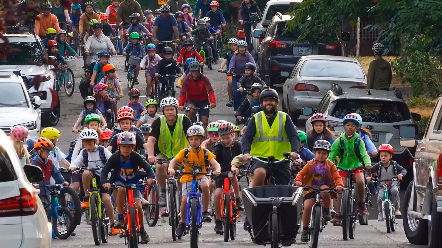 Bike Bus with children riding bikes in a big group to school