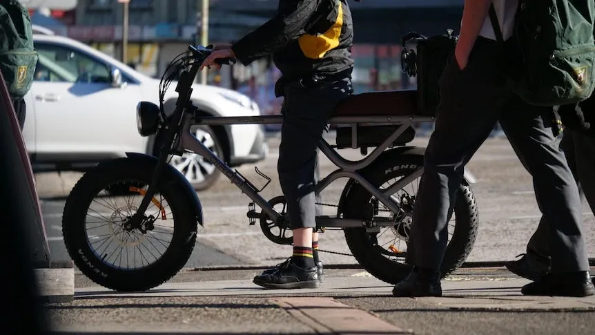 Person waiting at lights on an fat tyre ebike