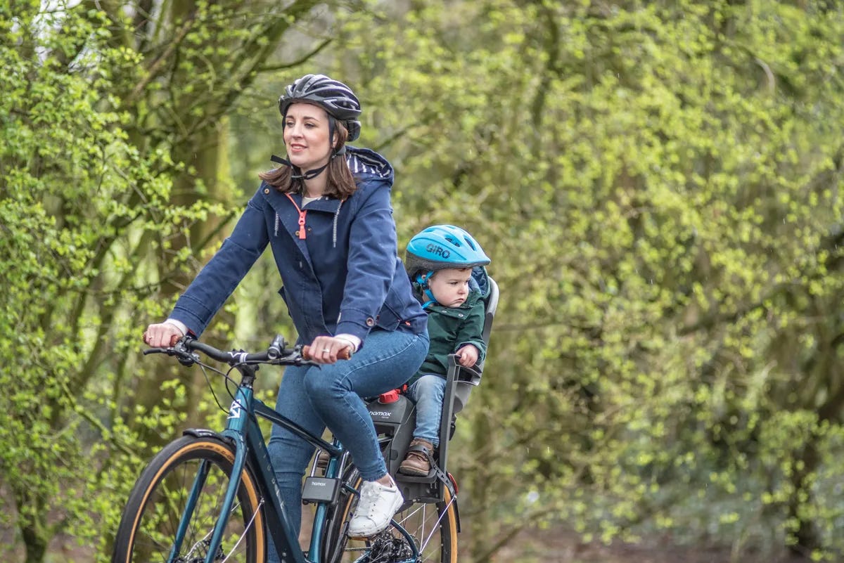 Ribble electric hybrid bike with child on seat
