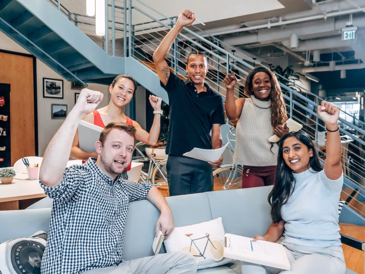 a group of people sitting on top of a couch